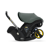 Black and gray baby car seat with yellow accents on a transparent background