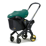 Doona stroller from behind showing the snap on storage bag