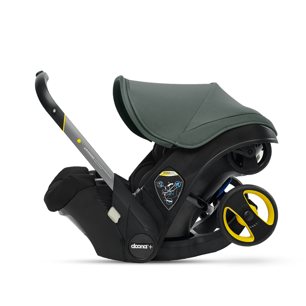 Black and gray baby car seat with yellow accents on a transparent background