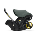 Black and gray baby car seat with yellow accents on a transparent background