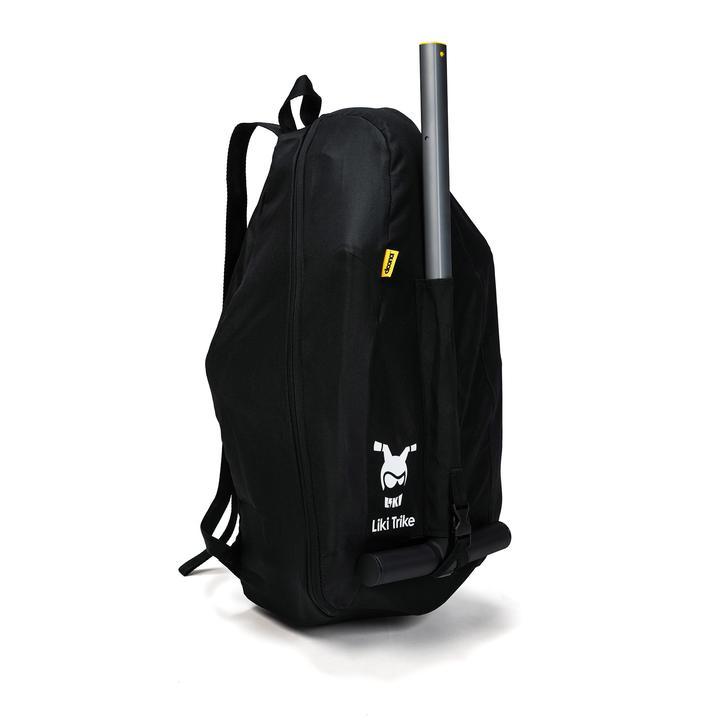 A black Liki Trike travel bag designed to carry a Liki Trike. The bag has shoulder straps and a space for the parent handle.