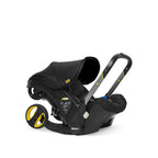 Doona black car seat with handle pulled up