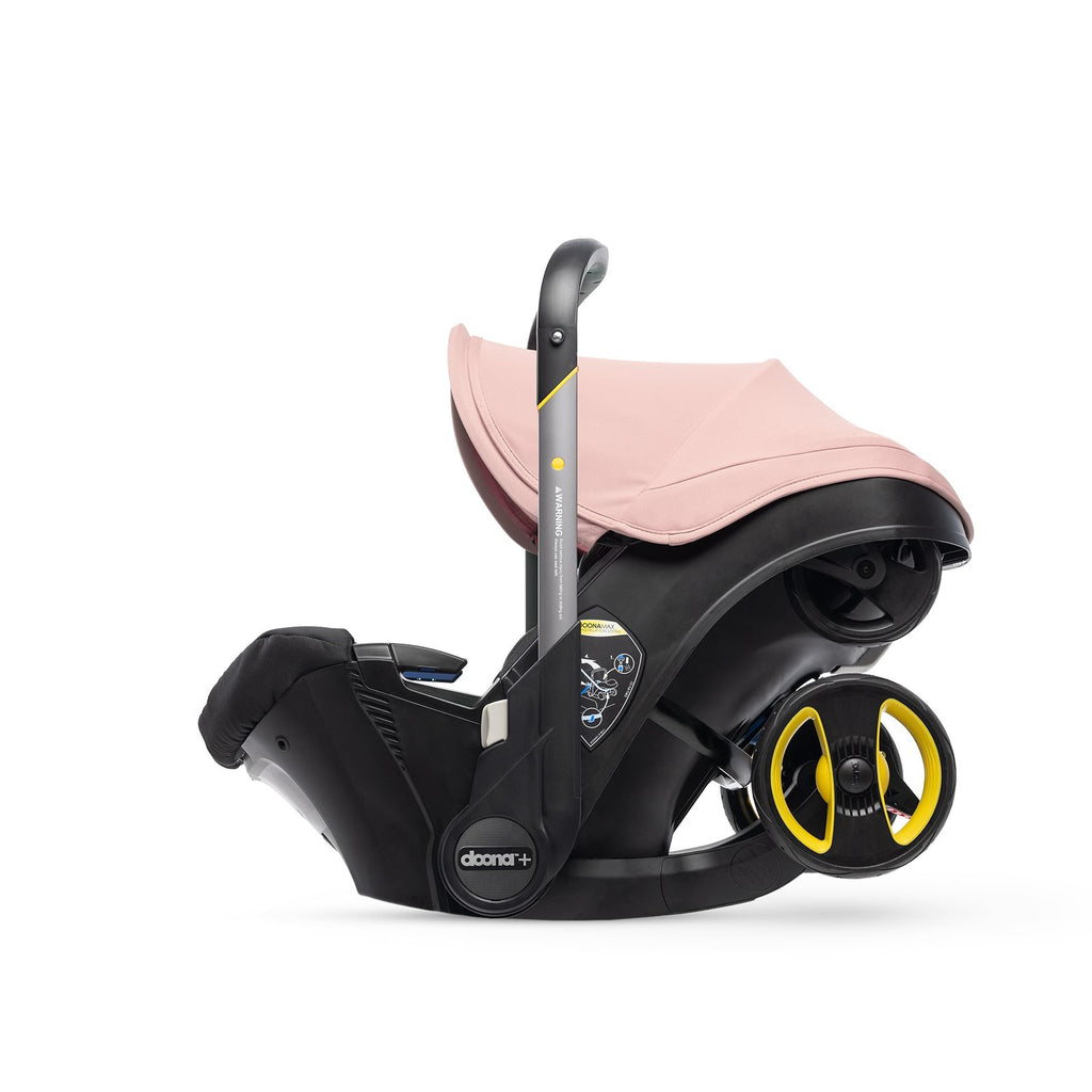 Doona car seat in blush pink. 