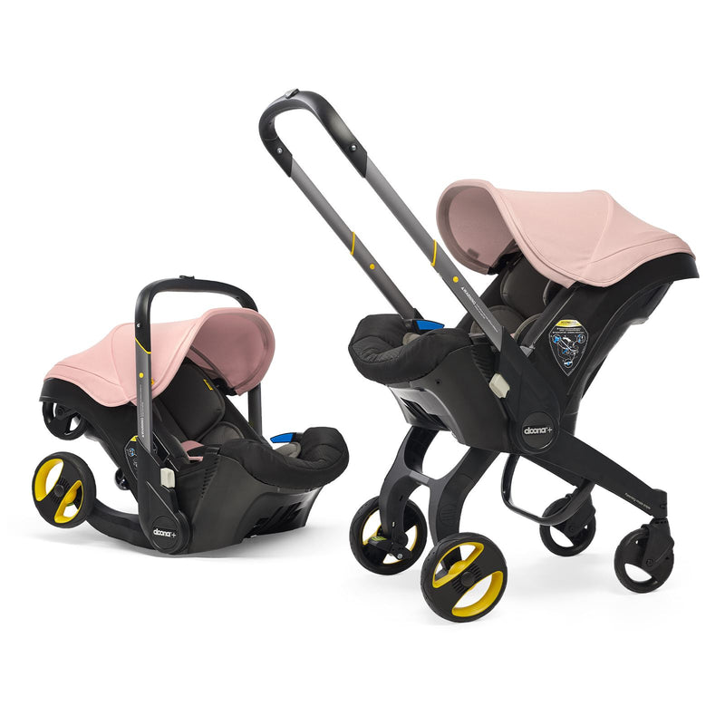 pink doona car seats, one folded and one as a stroller