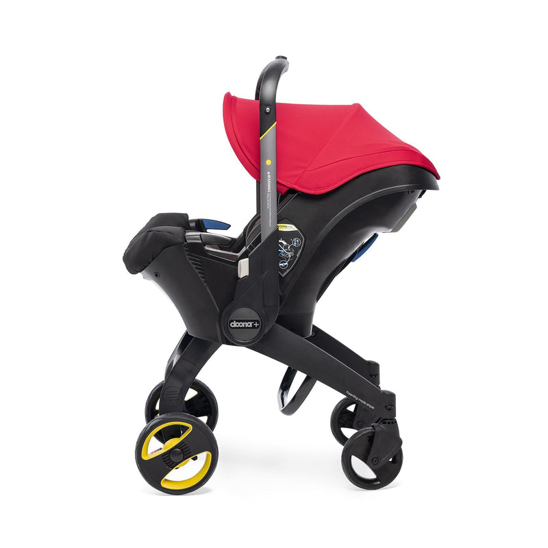 Doona red stroller from the side.