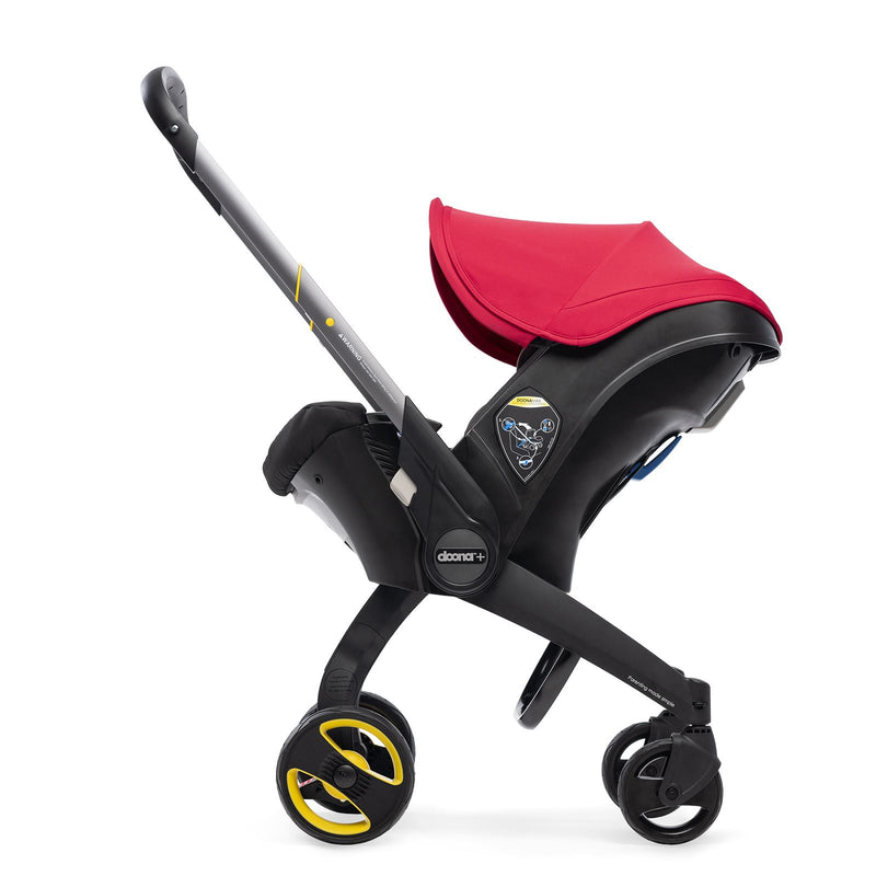 Doona red stroller with handle extended