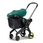 Doona stroller from behind showing the snap on storage bag